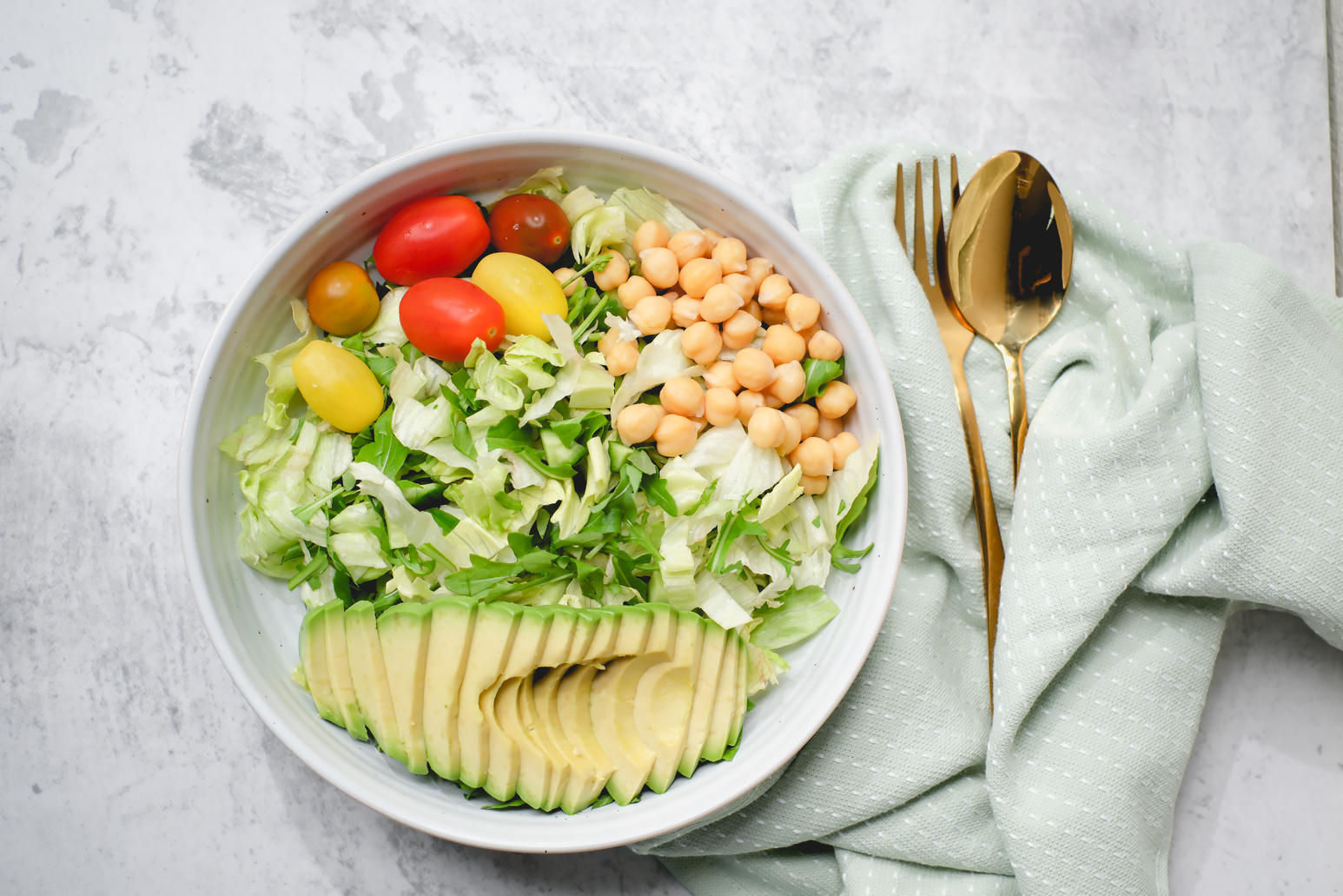 a healthy diet and low-carb food. mix salad and tomato and avocado for healthy eating and a vegan diet.